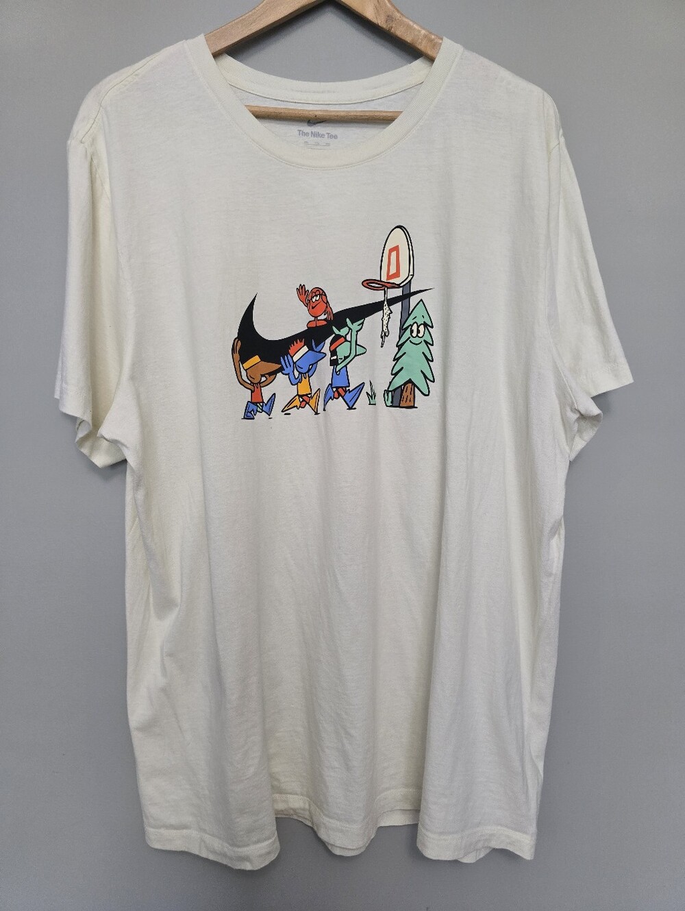 Nike Cream Short-Sleeve Tee with Multicolor Cartoon Graphic